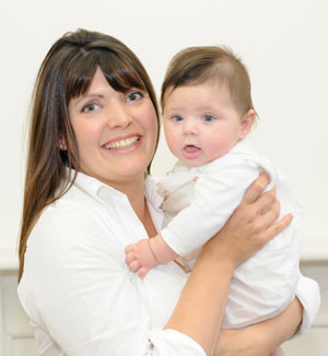  Sam Burlton founder of So Organic with her baby daughter